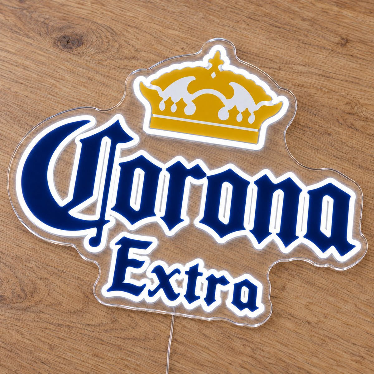 Corona Extra LED Neon Sign, featuring illuminated beer-brand logo on a wooden surface.