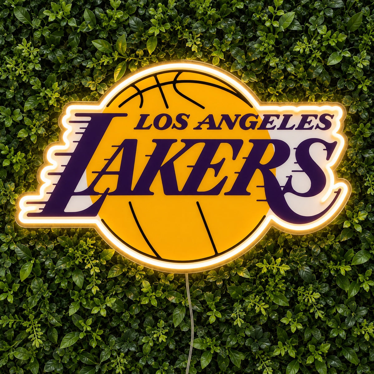 LA Lakers LED Neon Sign, featuring illuminated team logo on a green foliage wall.