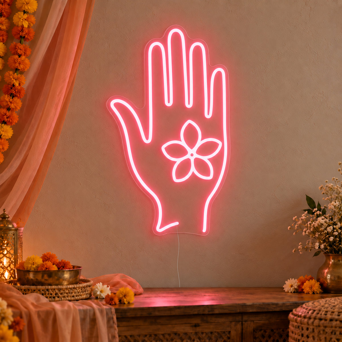 Henna Hand Neon Sign on clear cut-to-shape acrylic, illuminated on a wall in a styled celebration setting