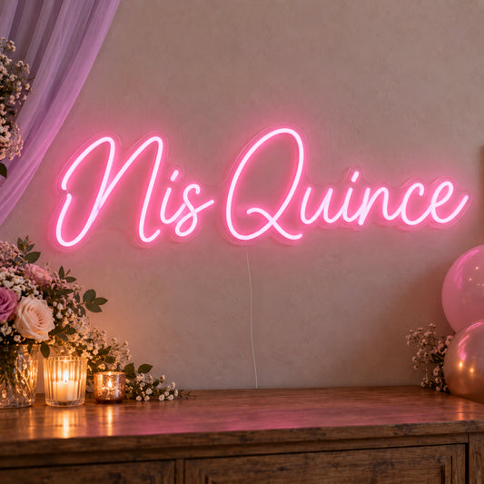 Mis Quince Neon Sign on clear cut-to-shape acrylic, illuminated on a wall in a styled celebration setting