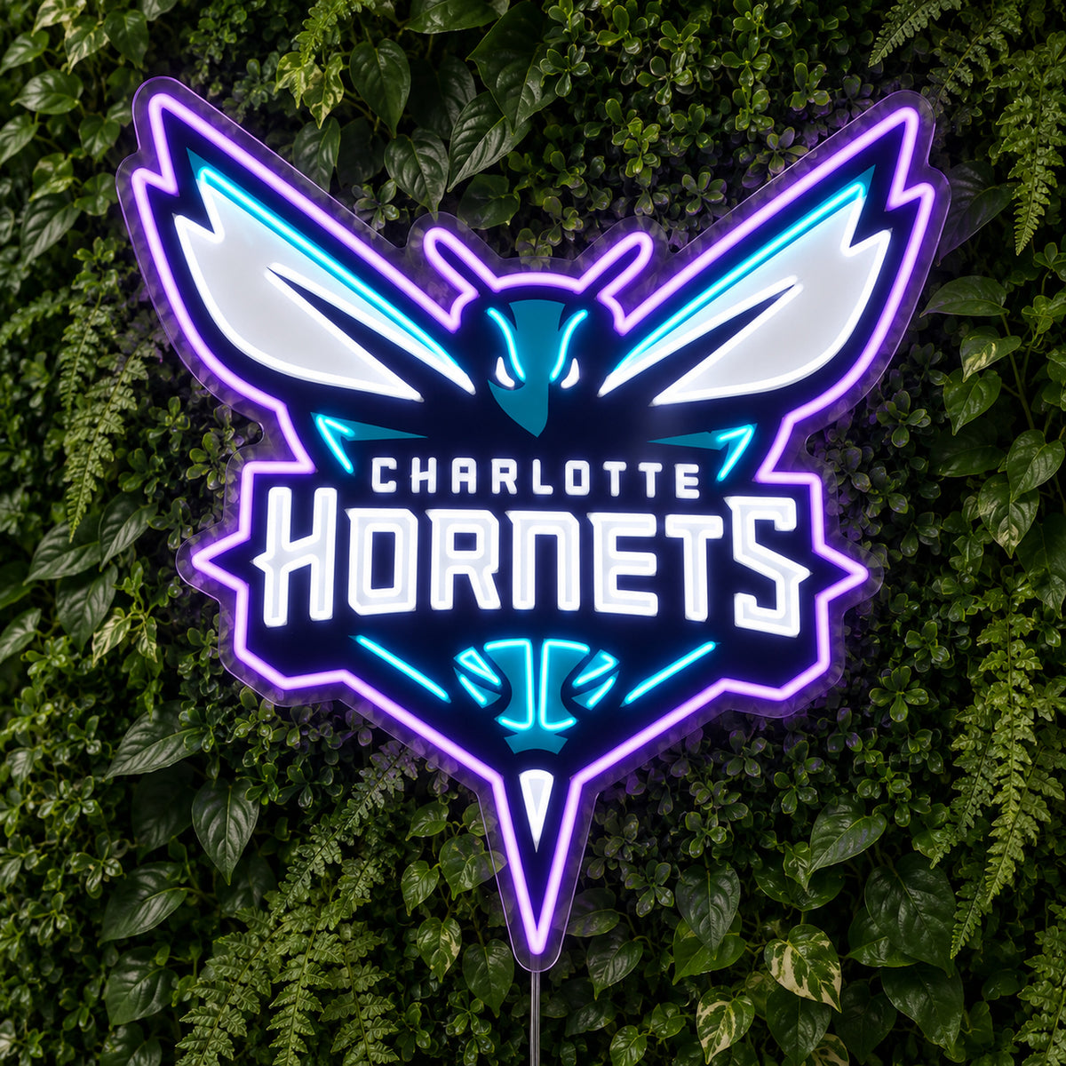 Charlotte Hornets LED Neon Sign, featuring team logo displayed on a green foliage wall.