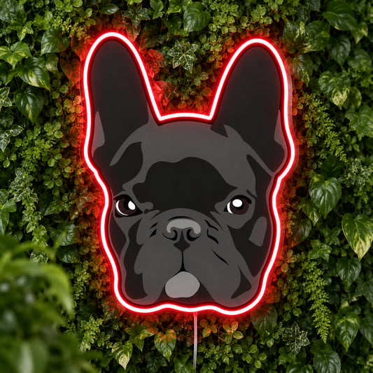 French Bulldog (Dark) LED Neon Sign in red, featuring a dark French bulldog face with a glowing outline against foliage.
