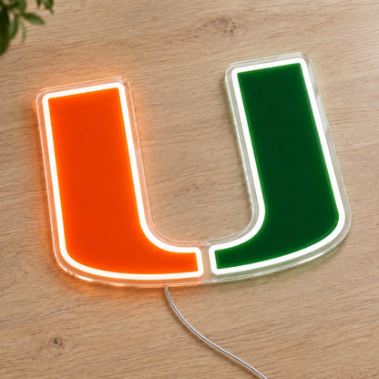 Miami Hurricanes LED Neon Sign, featuring team logo displayed on a wooden surface.