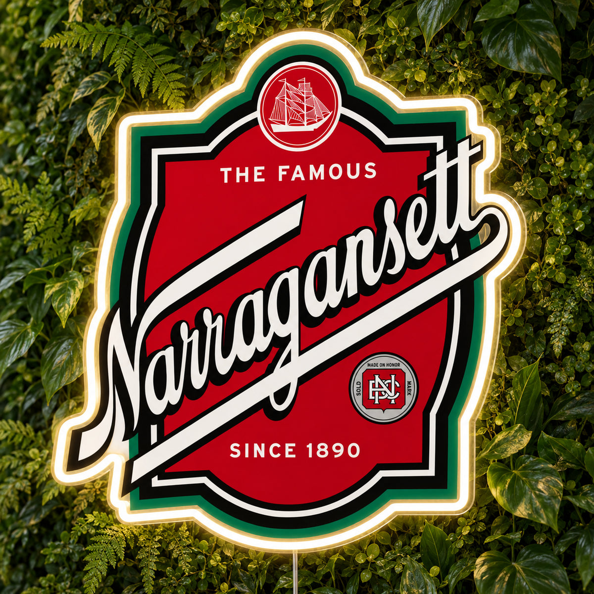 Narragansett LED Neon Sign, featuring beer-brand logo displayed on a green foliage wall.