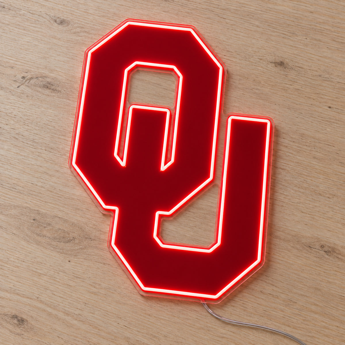 Oklahoma Sooners LED Neon Sign, featuring team logo displayed on a wooden surface.