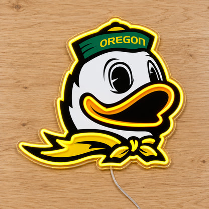 Oregon Ducks LED Neon Sign, featuring team logo displayed on a wooden surface.