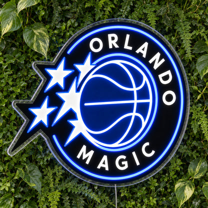 Orlando Magic LED Neon Sign, featuring illuminated team logo on a green foliage wall.
