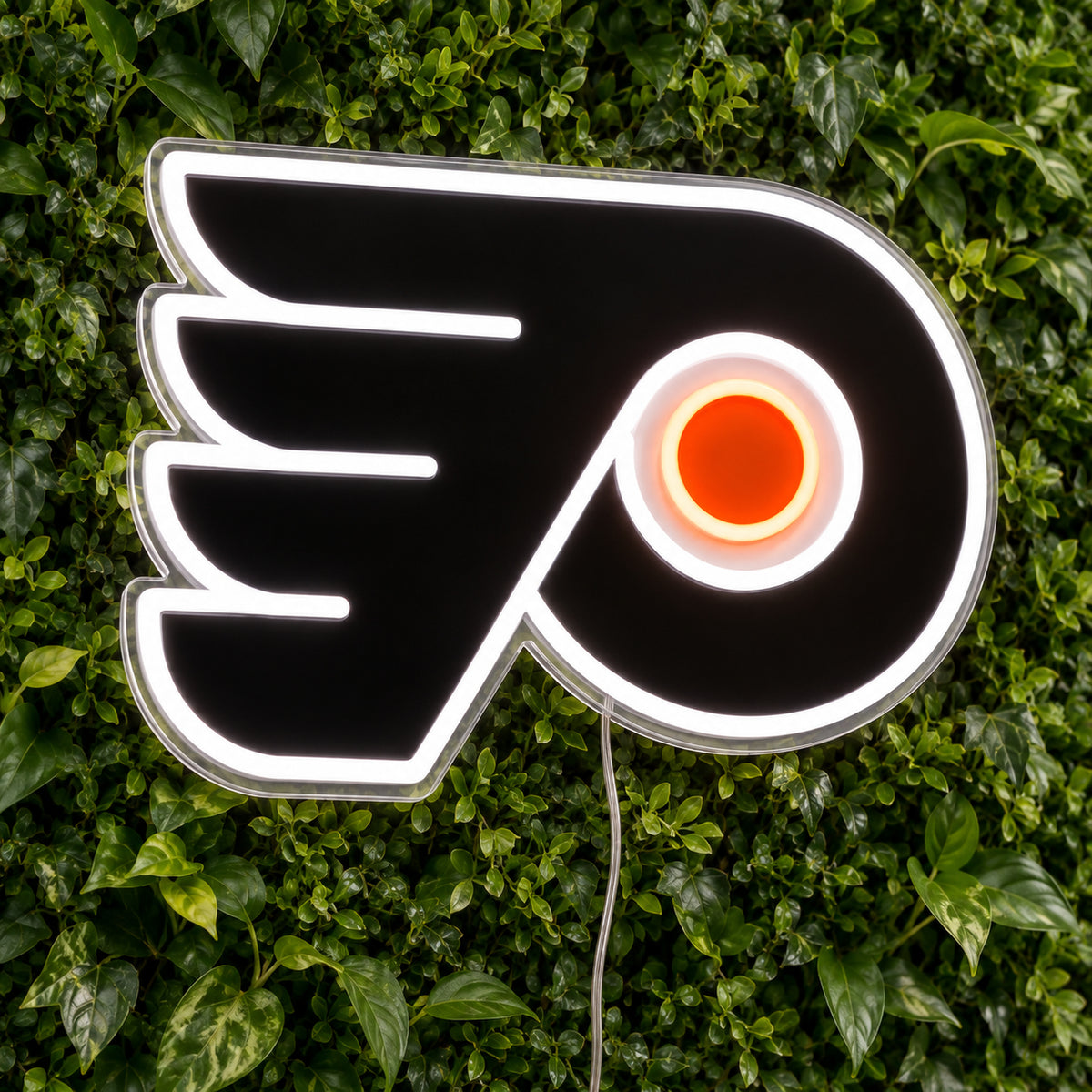 Philadelphia Flyers LED Neon Sign, featuring team logo displayed on a green foliage wall.