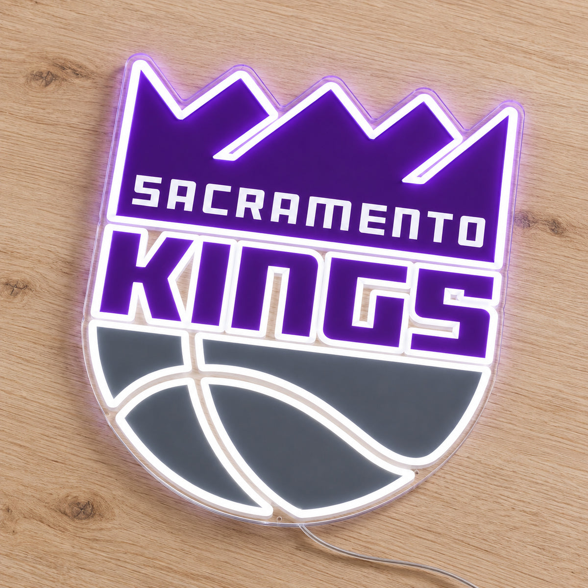 Sacramento Kings LED Neon Sign, featuring team logo displayed on a wooden surface.