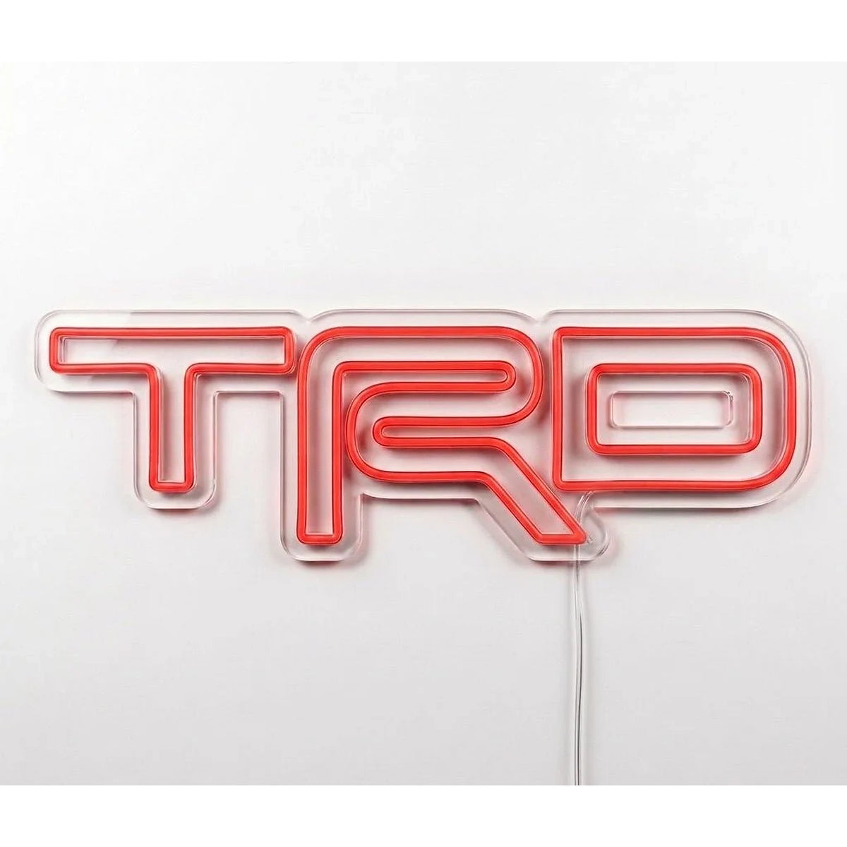 Toyota TRD Neon Sign in red, featuring TRD logo on a white wall.