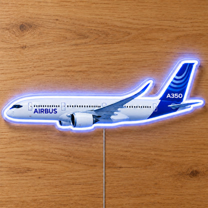 Airbus A350 Neon Sign with printed aircraft details and an illuminated LED outline on clear acrylic, shown on a wooden surface