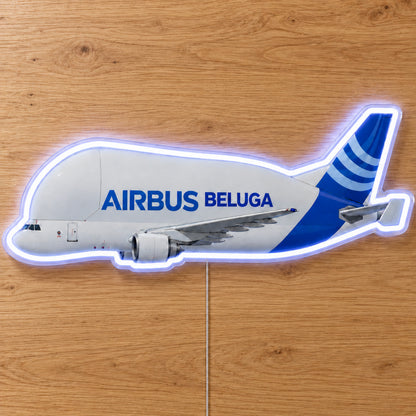 Airbus Beluga Neon Sign with printed aircraft details and an illuminated LED outline on clear acrylic, shown on a wooden surface