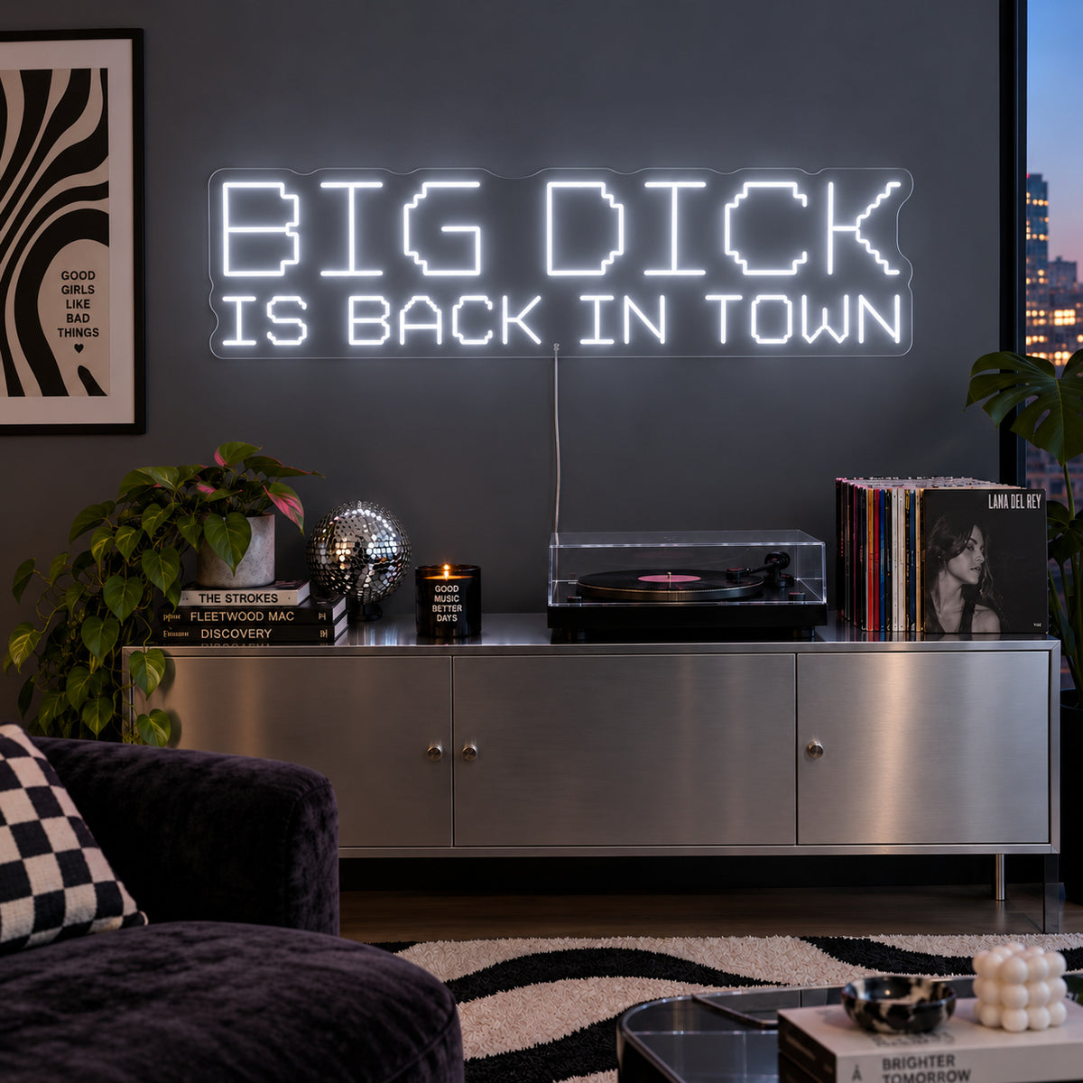 Big Dick Is Back In Town Neon Sign, RGB colour-changing option shown in white above a record player and metal sideboard.