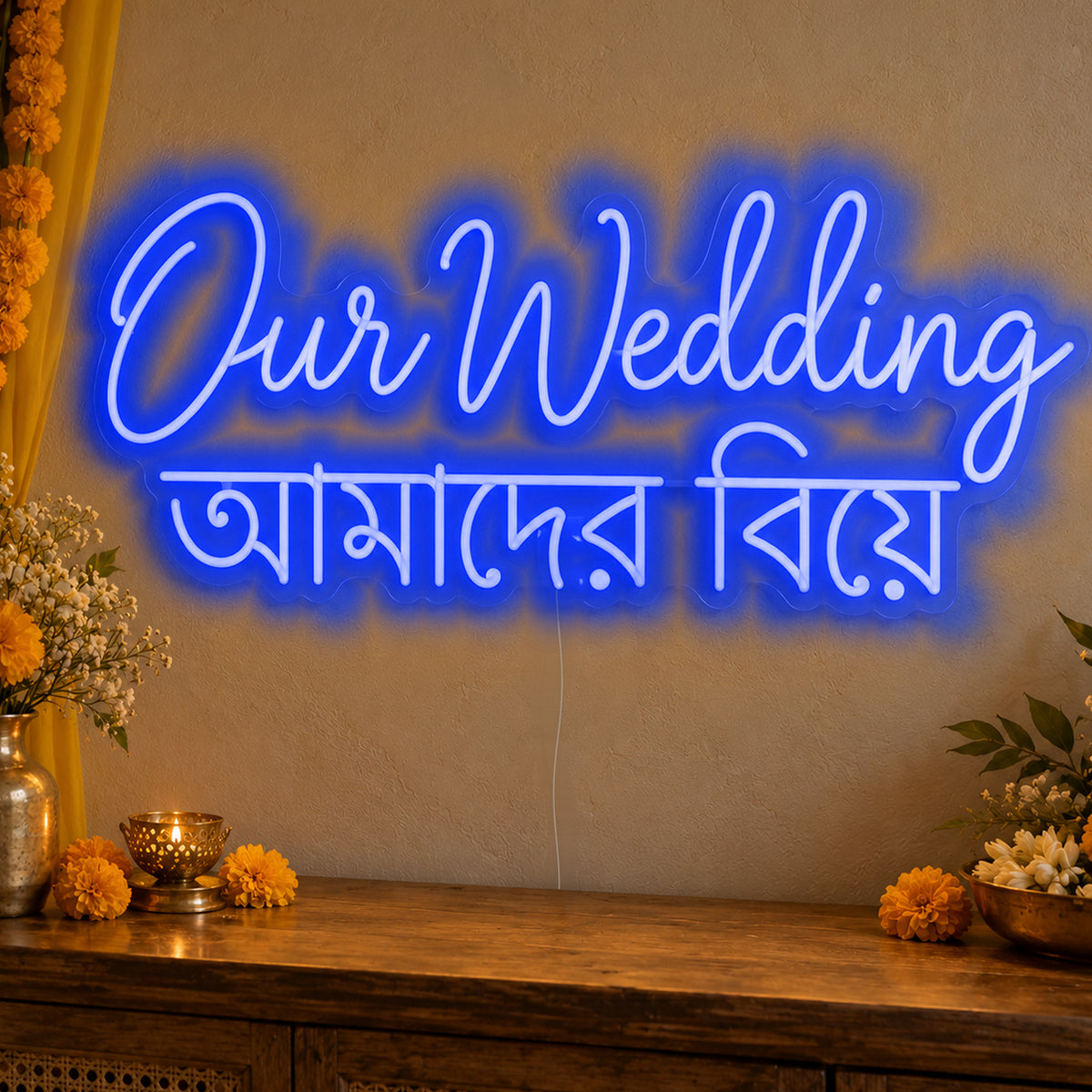 Our Wedding English & Bengali Neon Sign in blue LED neon on clear acrylic, angled view
