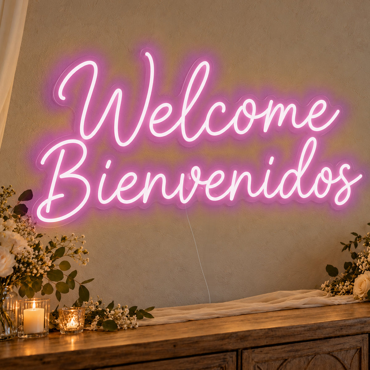 Welcome English & Spanish Neon Sign in pink LED neon on clear acrylic, angled view