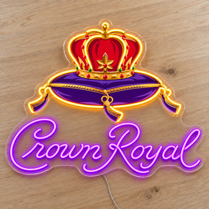 Crown Royal LED neon sign on a light wooden surface, front view