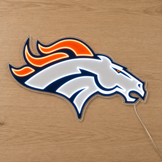 Denver Broncos LED neon sign with horse logo glowing orange and white on a timber wall