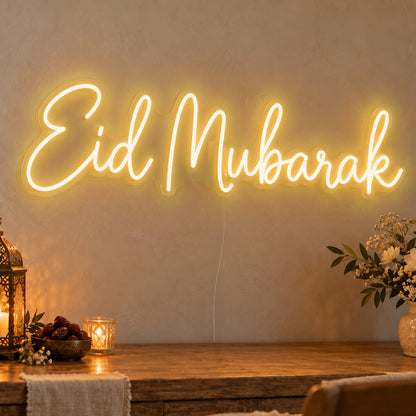 Eid Mubarak Neon Sign in gold LED neon on clear acrylic, angled view