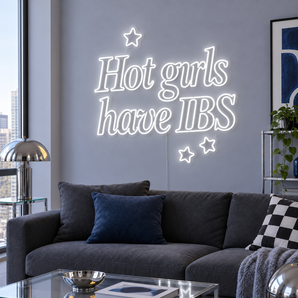 Hot Girls Have IBS Neon Sign, RGB colour-changing option shown in white with star details above a charcoal sofa.
