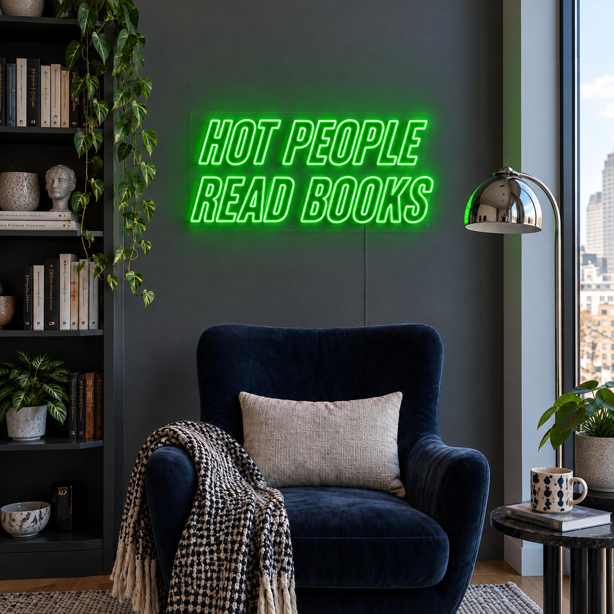 Hot People Read Books Neon Sign with green lighting, displayed above a blue reading chair.