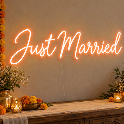 Just Married Neon Sign in orange LED neon on clear acrylic, angled view