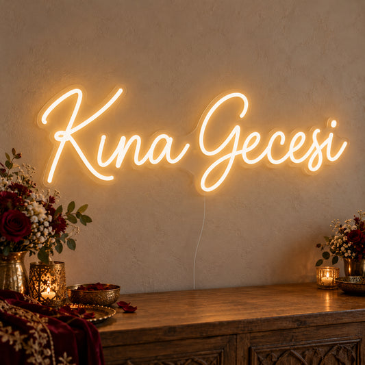 Kına Gecesi Neon Sign on clear cut-to-shape acrylic, illuminated on a wall in a styled celebration setting