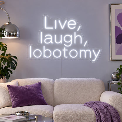 Live, Laugh, Lobotomy Neon Sign glowing white above a cream sofa with purple cushions.