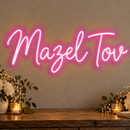Mazel Tov Neon Sign in rose red LED neon on clear acrylic, angled view