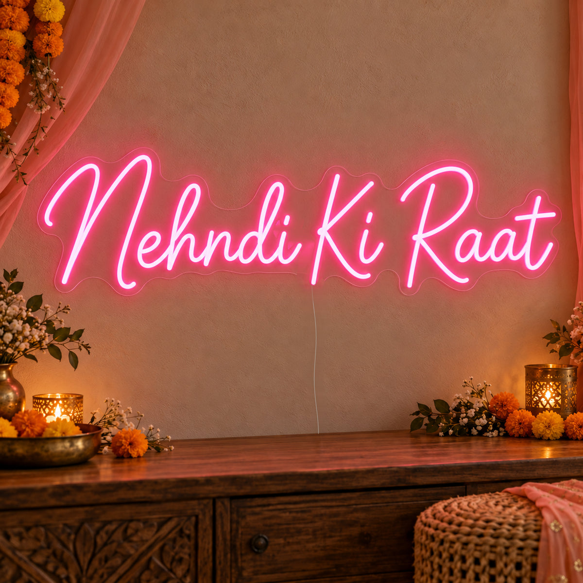 Mehndi Ki Raat Neon Sign on clear cut-to-shape acrylic, illuminated on a wall in a styled celebration setting