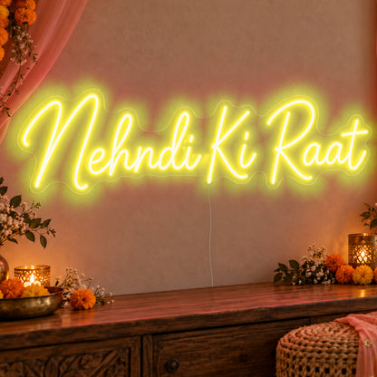 Mehndi Ki Raat Neon Sign in yellow LED neon on clear acrylic, angled view