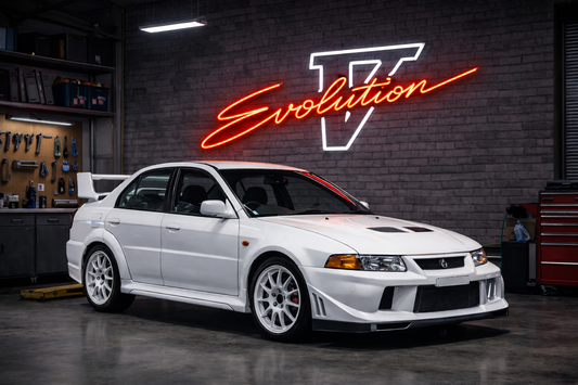 Red Mitsubishi Lancer Evolution V inspired LED neon sign on garage wall, premium car neon sign Australia by Neon Lanes.