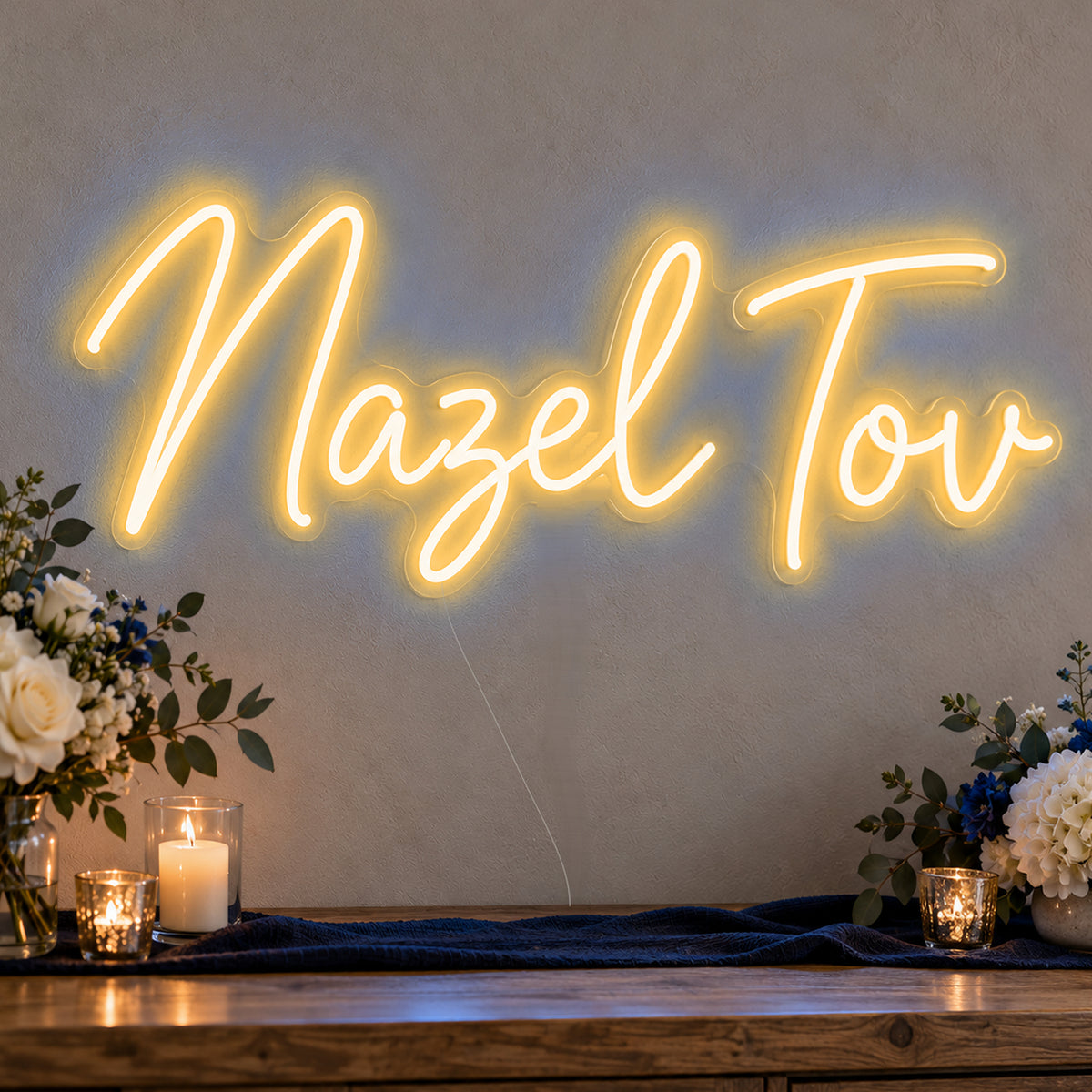 Mazel Tov Blue Neon Sign in gold LED neon on clear acrylic, angled view