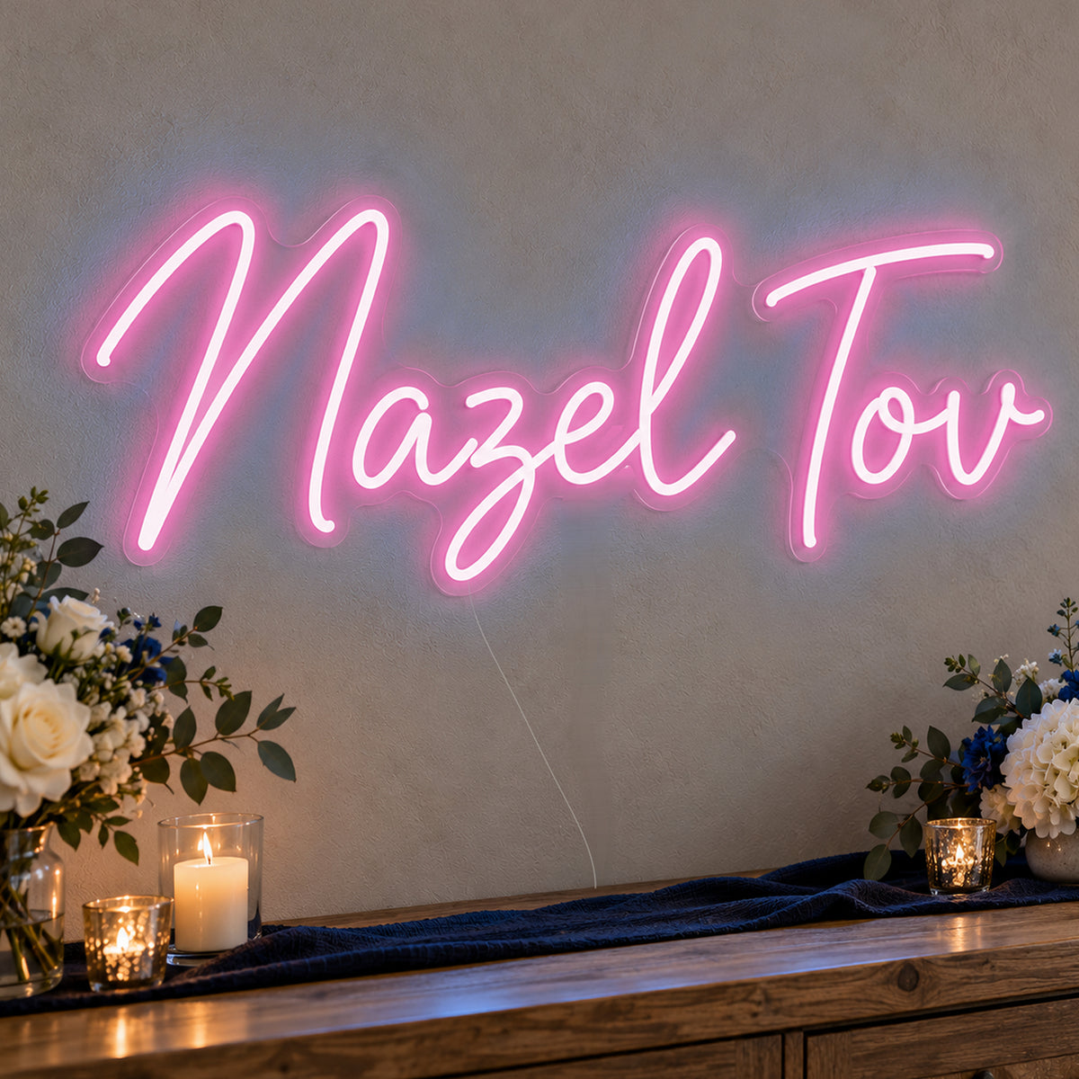 Mazel Tov Blue Neon Sign in pink LED neon on clear acrylic, angled view