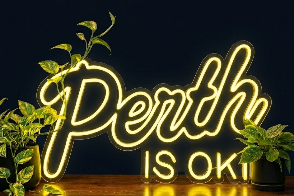 Perth is OK! neon sign on a dark background with plants, shown as custom sign inspiration for Armadale.