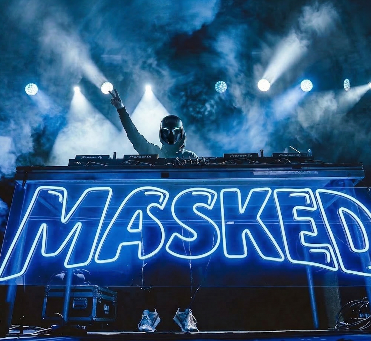 Blue MASKED LED neon sign across a DJ booth, shown as custom sign inspiration for Logan.