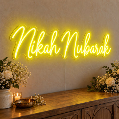 Nikah Mubarak Neon Sign in yellow LED neon on clear acrylic, angled view