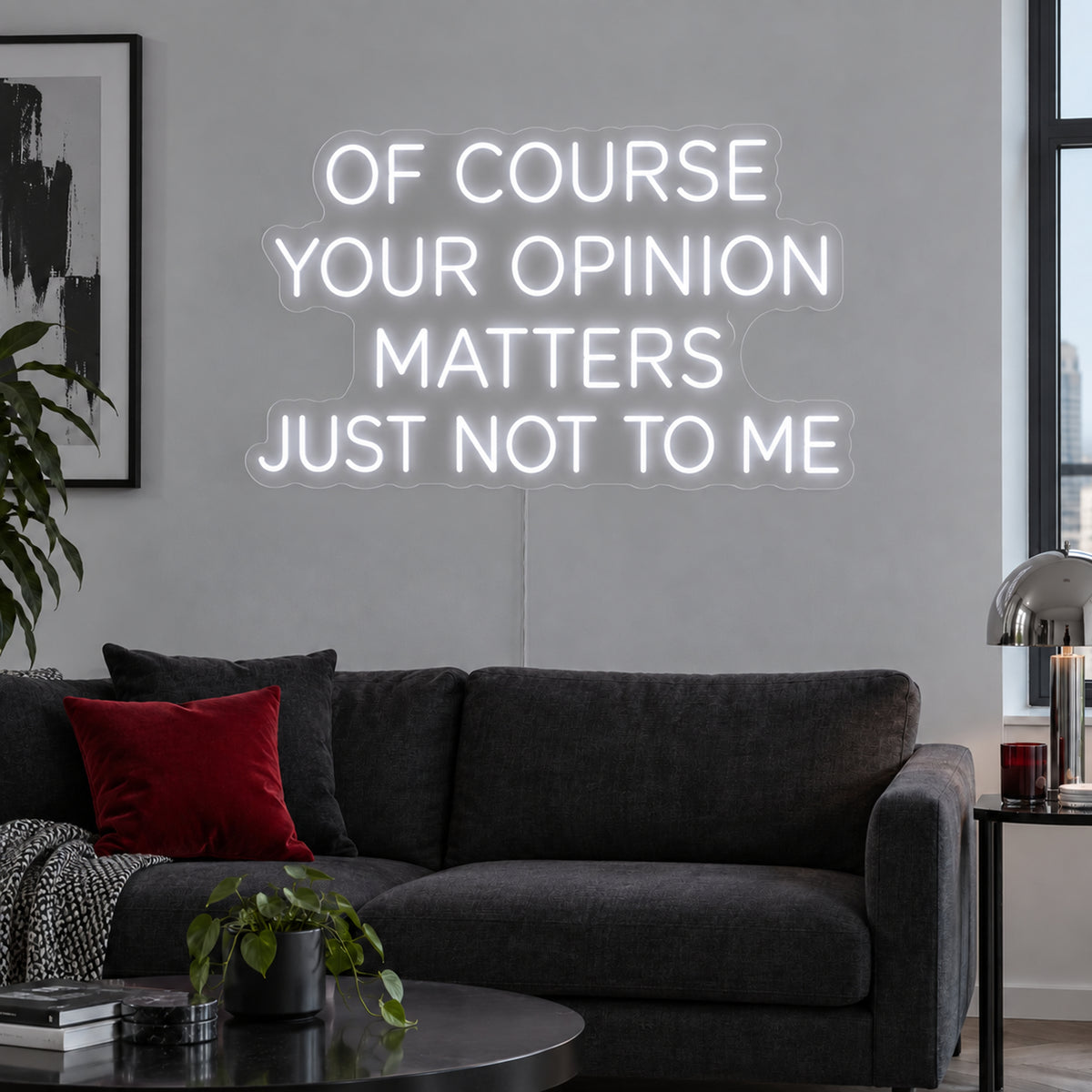 Of Course Your Opinion Matters Just Not To Me Neon Sign in white above a black sofa.