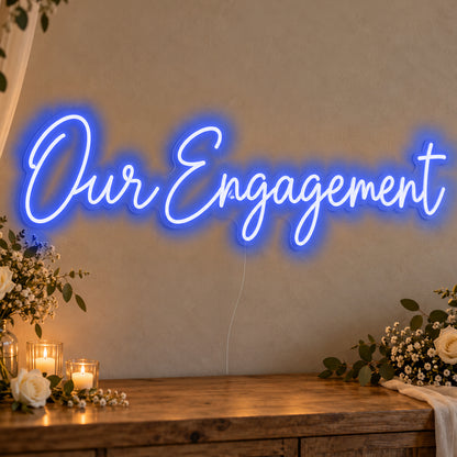 Our Engagement Neon Sign in blue LED neon on clear acrylic, angled view