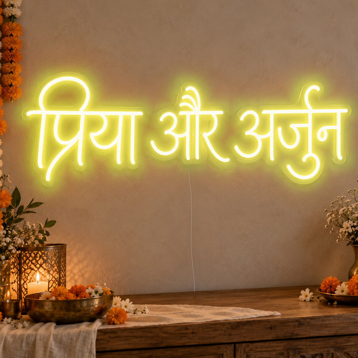 Personalised Devanagari Couple Names Neon Sign in yellow LED neon on clear acrylic, angled view