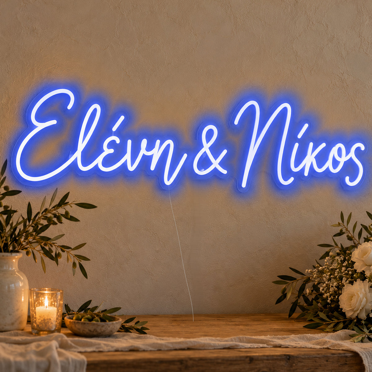 Personalised Greek Couple Names Neon Sign in blue LED neon on clear acrylic, angled view