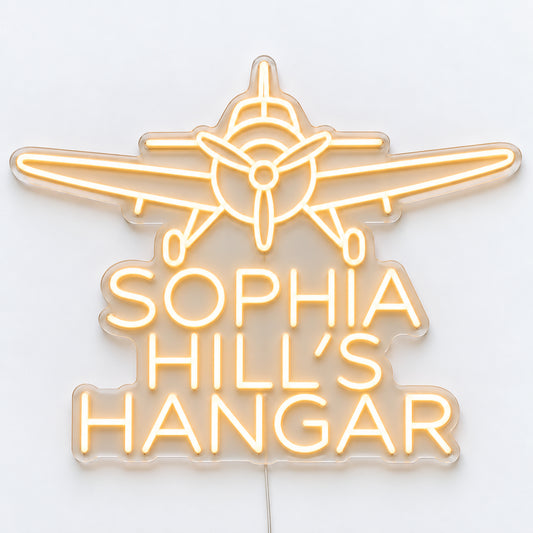 Personalised Hangar Neon Sign, featuring a personalised hangar sign, shown as Sophia Hill’s Hangar, on a single clear acrylic backing displayed on a white surface.