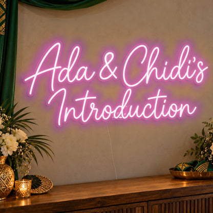 Personalised Introduction Neon Sign in pink LED neon on clear acrylic, angled view