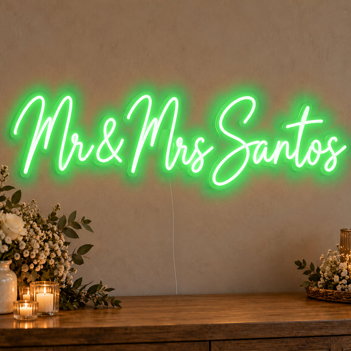 Personalised Mr & Mrs Surname Neon Sign in green LED neon on clear acrylic, angled view