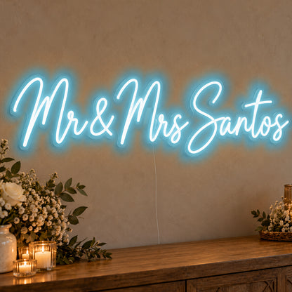 Personalised Mr & Mrs Surname Neon Sign in ice blue LED neon on clear acrylic, angled view