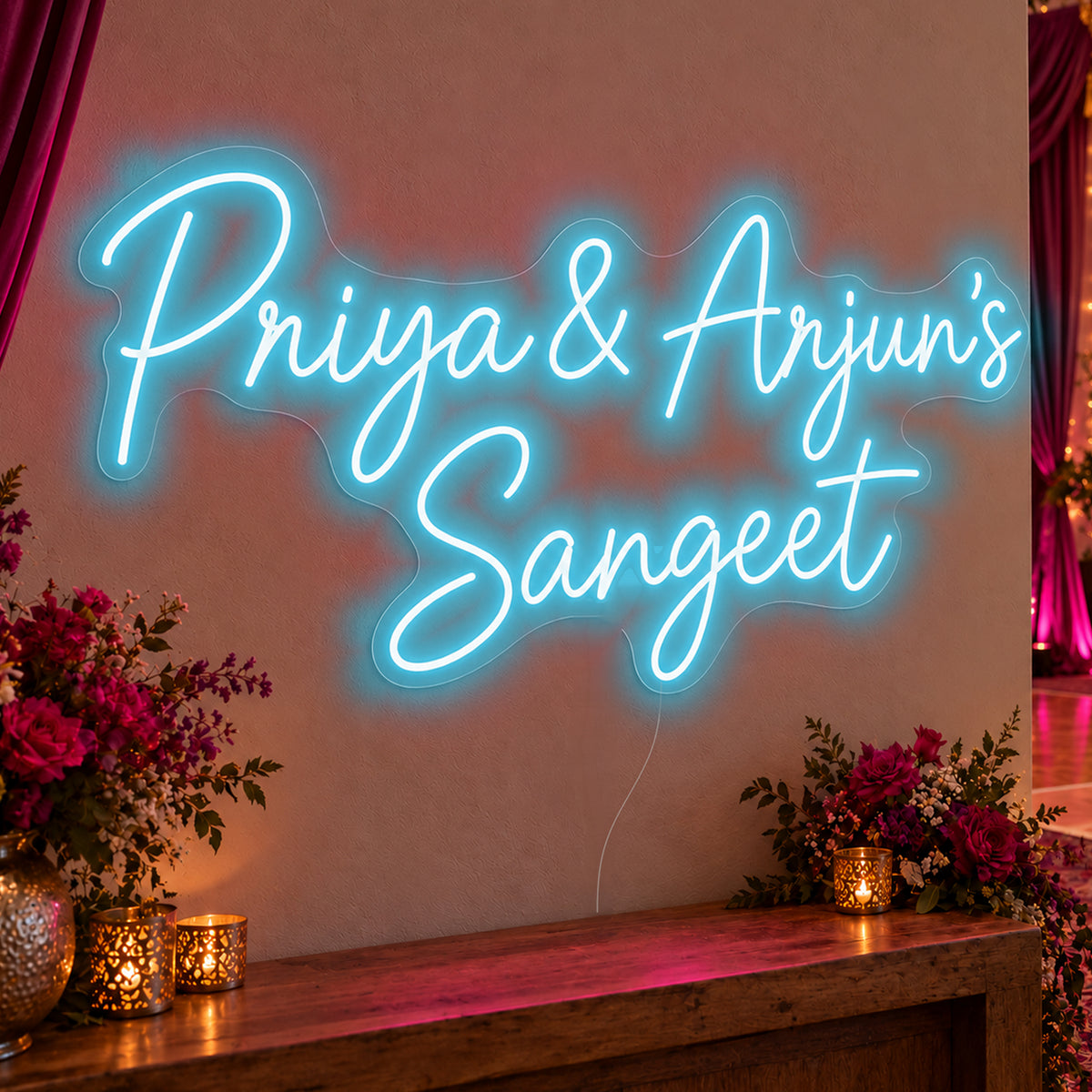 Personalised Sangeet Neon Sign in ice blue LED neon on clear acrylic, angled view
