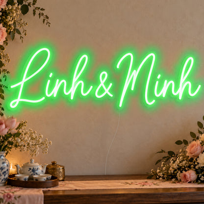Personalised Vietnamese Couple Names Neon Sign in green LED neon on clear acrylic, angled view