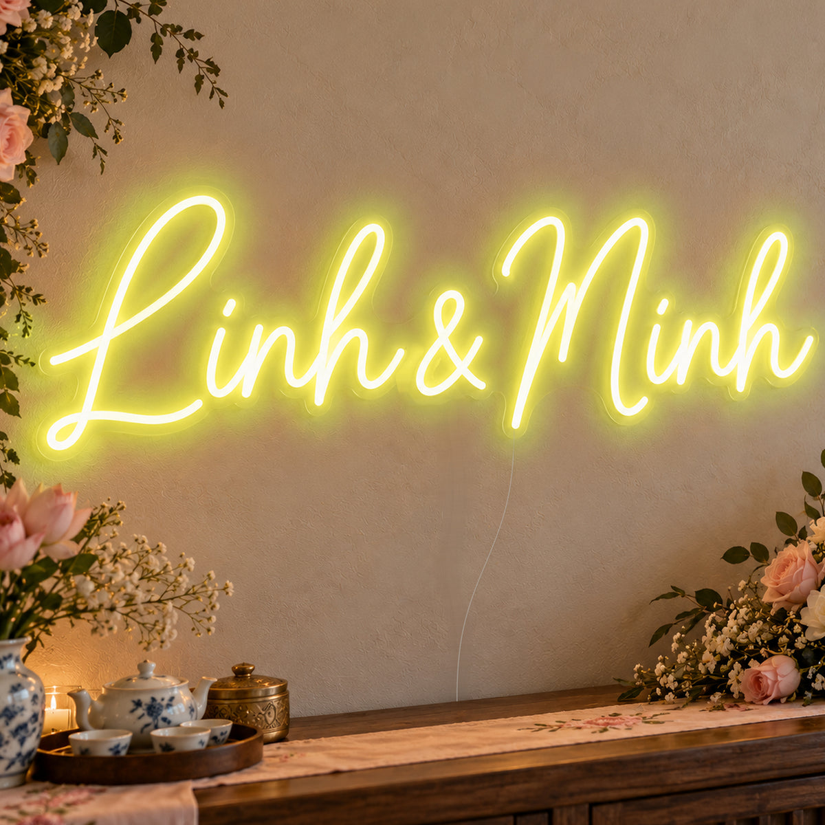 Personalised Vietnamese Couple Names Neon Sign in yellow LED neon on clear acrylic, angled view