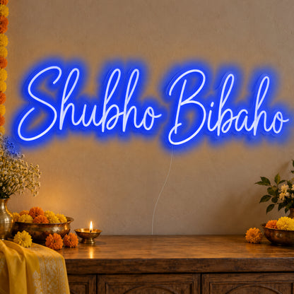 Shubho Bibaho Neon Sign in blue LED neon on clear acrylic, angled view