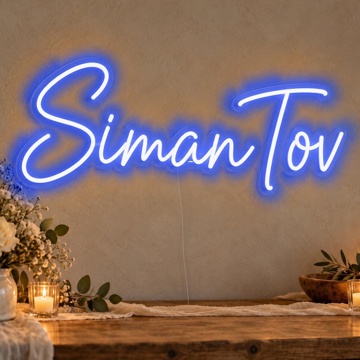 Siman Tov Neon Sign in blue LED neon on clear acrylic, angled view