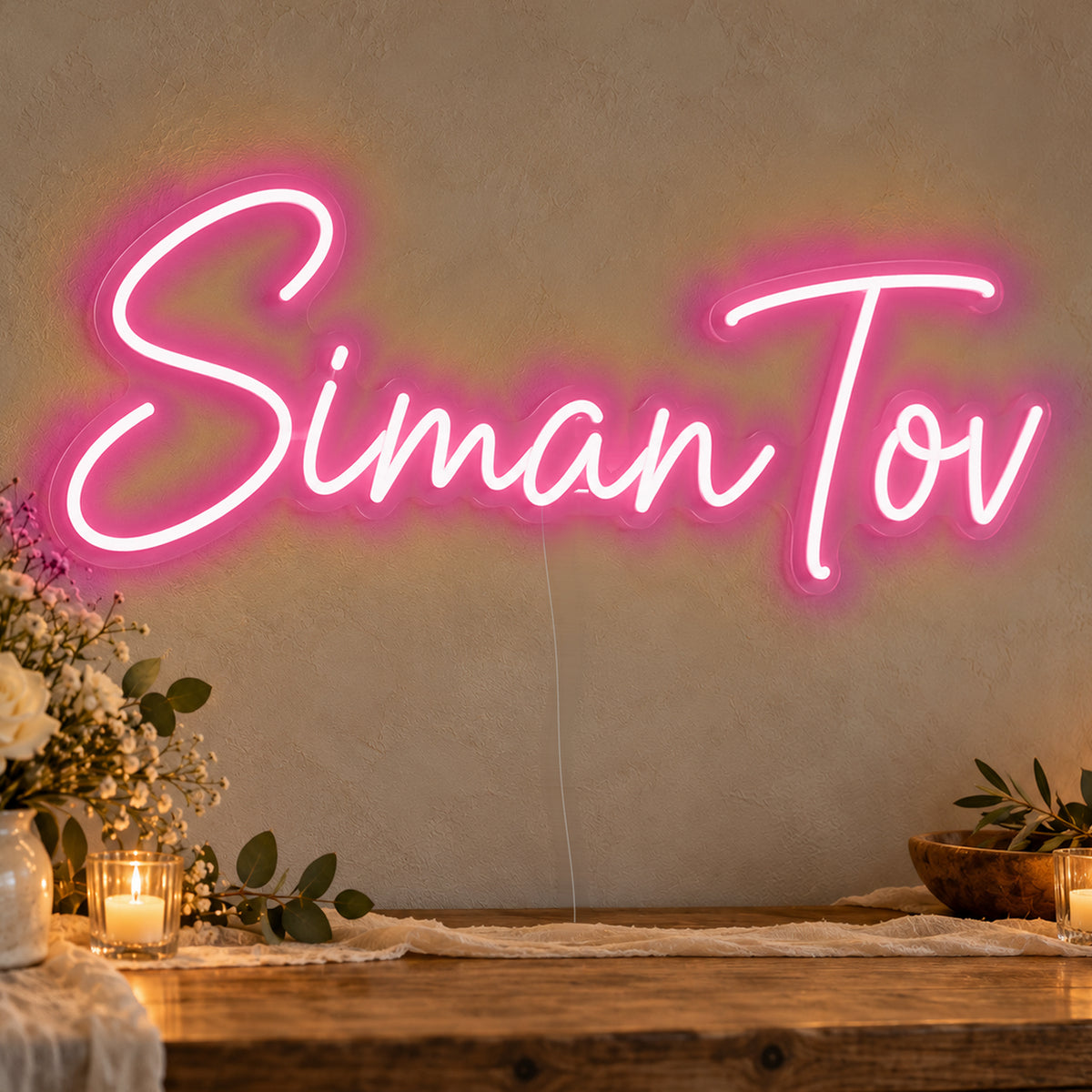 Siman Tov Neon Sign in rose red LED neon on clear acrylic, angled view